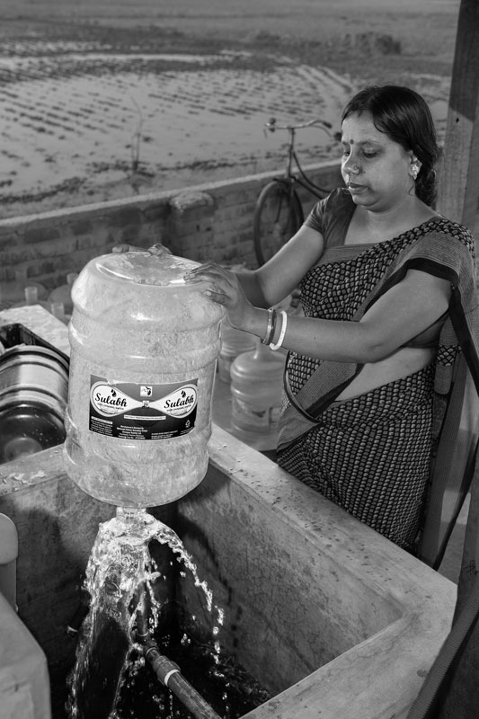 A 20 liters jar being thoroughly rinsed from inside at the Sulabh Safe Drinking Water plant in Panchberia village, Paschim Medinipur district, West Bengal